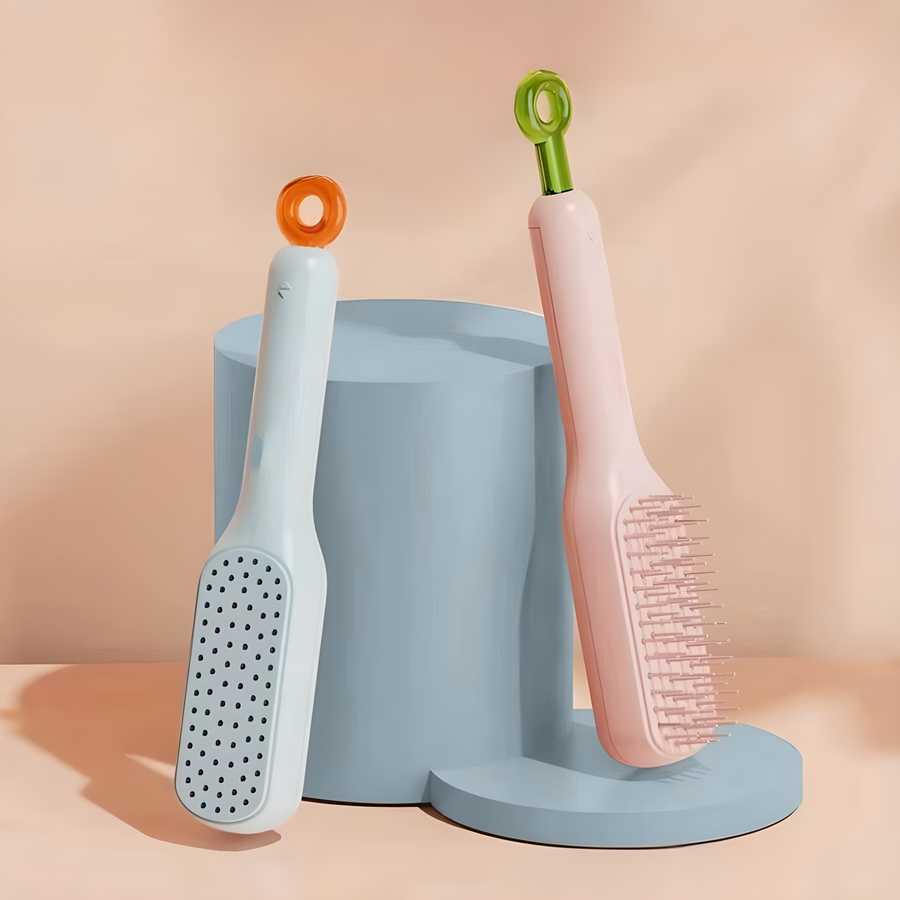 Two grooming brushes with colorful handles on a blue stand against a peach background