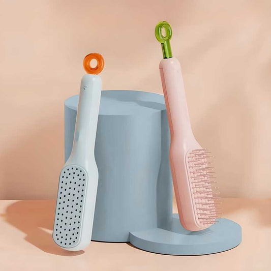 Two grooming brushes with colorful handles on a blue stand against a peach background